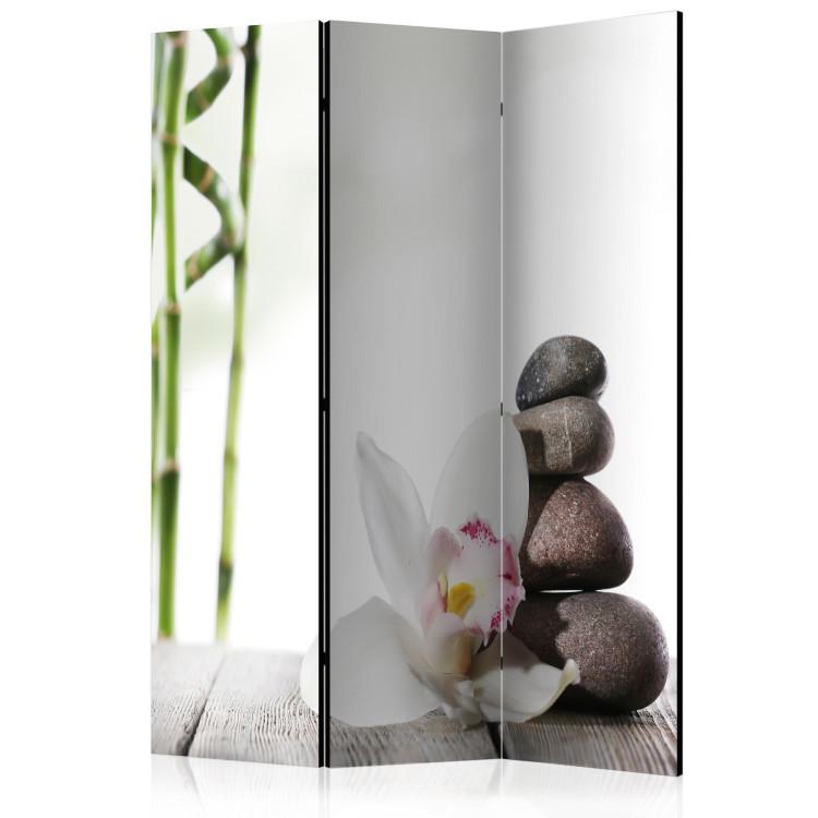 Room Divider Harmony - stones and lily flower on a wooden table in oriental style