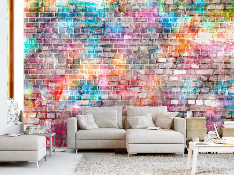 Wall Mural Colours of the rainbow - urban brick wall in a colourful pattern for teenagers