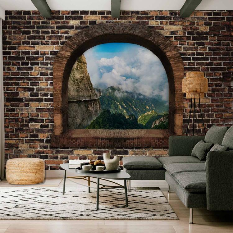 Wall Mural Futuristic window - landscape with mountains surrounded by clouds and 3D effect
