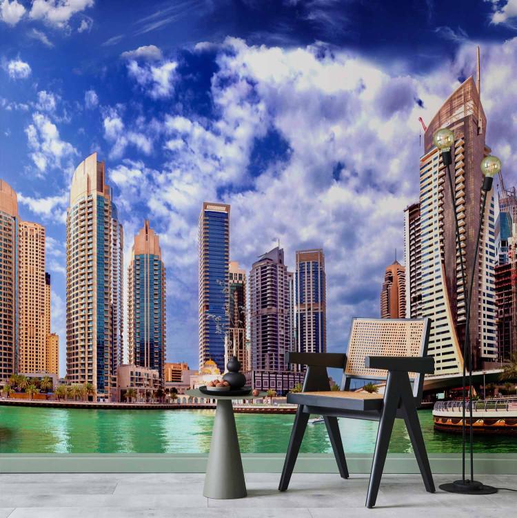 Wall Mural Dubai - white clouds against architecture with modern skyscrapers