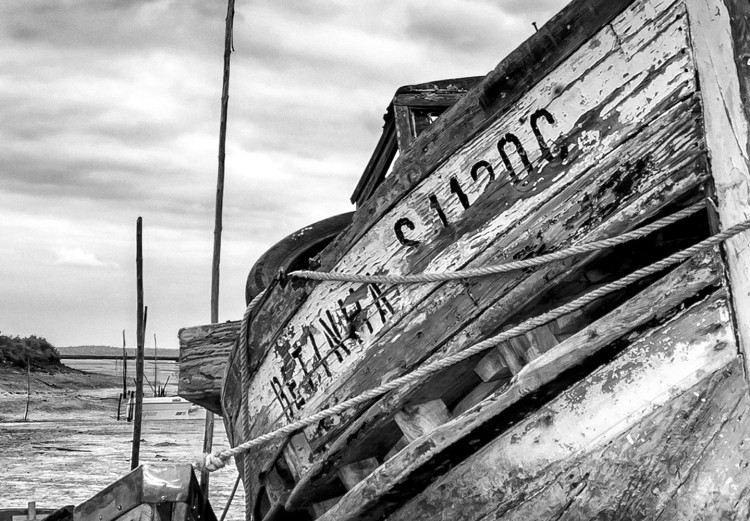 Wall Poster Journey into Nature - black and white abandoned boat against sky and clouds 138720 additionalImage 10