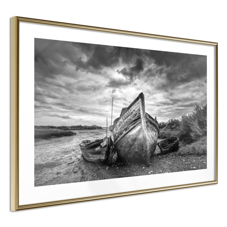 Wall Poster Journey into Nature - black and white abandoned boat against sky and clouds 138720 additionalImage 2