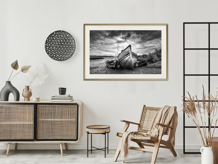 Wall Poster Journey into Nature - black and white abandoned boat against sky and clouds 138720 additionalImage 27
