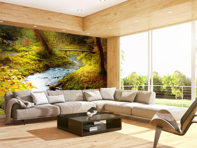 Wall Mural Among Trees - River with Waterfall Flowing through a Forest with a Bridge in the Background 59830
