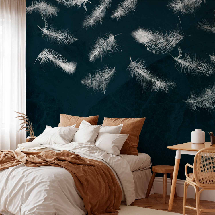 Wall Mural In flight - white feathers carried by the wind on a dark blue background with pattern 142640 additionalImage 2
