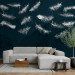 Wall Mural In flight - white feathers carried by the wind on a dark blue background with pattern 142640