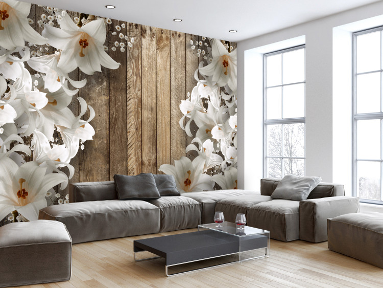 Photo Wallpaper White lilies on wooden wall - a floral motif on brown background 125170