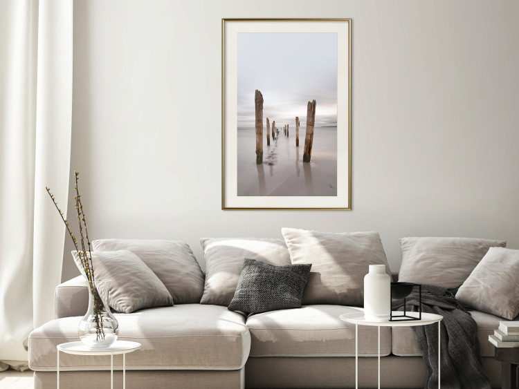 Poster Illusory Calm - seascape with wooden posts against the sky 130270 additionalImage 22