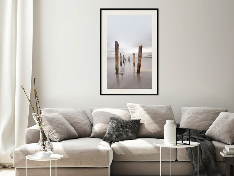 Poster Illusory Calm - seascape with wooden posts against the sky 130270 additionalImage 24