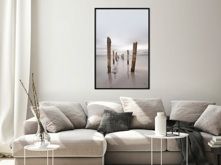 Poster Illusory Calm - seascape with wooden posts against the sky 130270 additionalImage 4