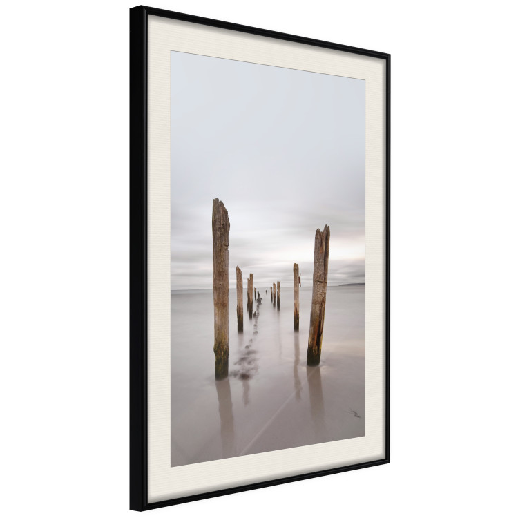 Poster Illusory Calm - seascape with wooden posts against the sky 130270 additionalImage 2