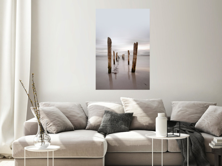 Poster Illusory Calm - seascape with wooden posts against the sky 130270 additionalImage 4