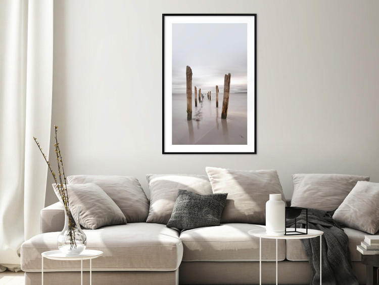 Poster Illusory Calm - seascape with wooden posts against the sky 130270 additionalImage 23