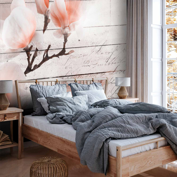 Wall Mural Delicacy of magnolia - orange and white flower against white boards 62470 additionalImage 2