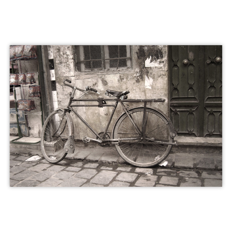 Poster Two-Wheeler - urban scene of a stone street with a vintage-style bicycle 116701