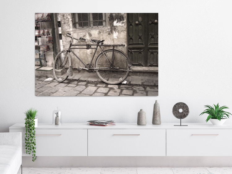 Poster Two-Wheeler - urban scene of a stone street with a vintage-style bicycle 116701 additionalImage 23
