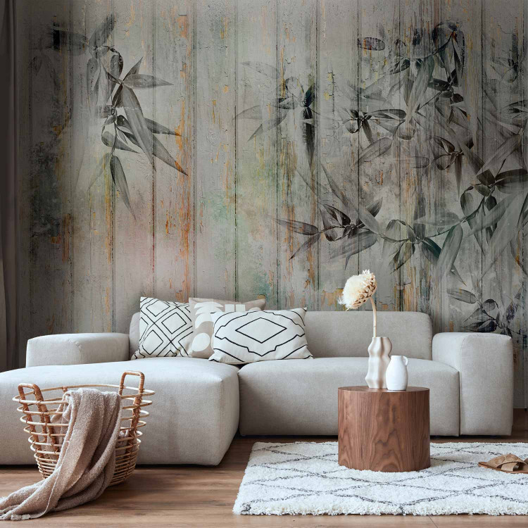 Wall Mural Descending paint - minimalist leaves on a background of wooden boards 142711