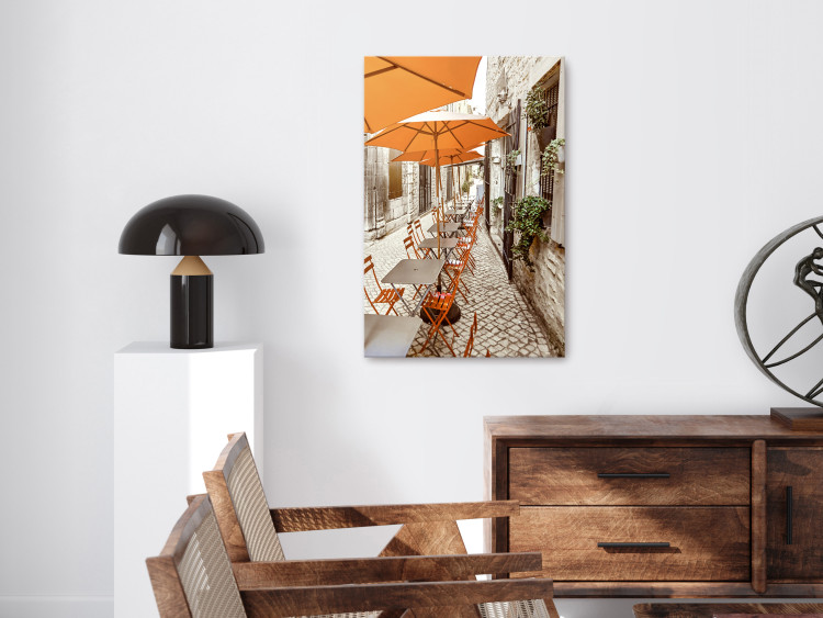 Canvas Print Italian Cafe - a photo of a narrow streets with tables and umbrellas 135841 additionalImage 3