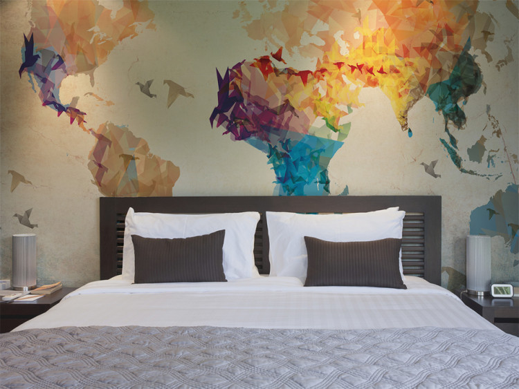 Wall Mural World map - colourful outline of the continents with a flying bird motif 96861