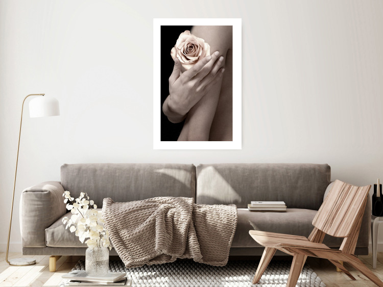 Wall Poster Subtle Fragrance - woman's hand holding rose flower on black background 128081 additionalImage 3
