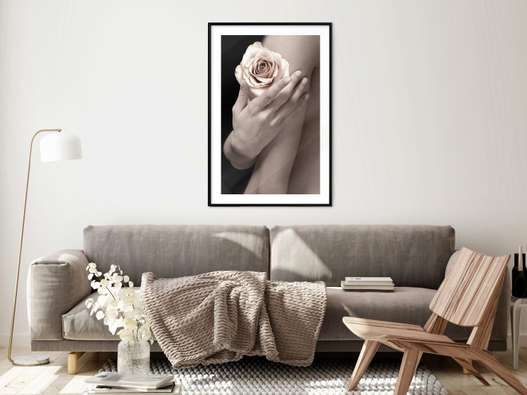Wall Poster Subtle Fragrance - woman's hand holding rose flower on black background 128081 additionalImage 18