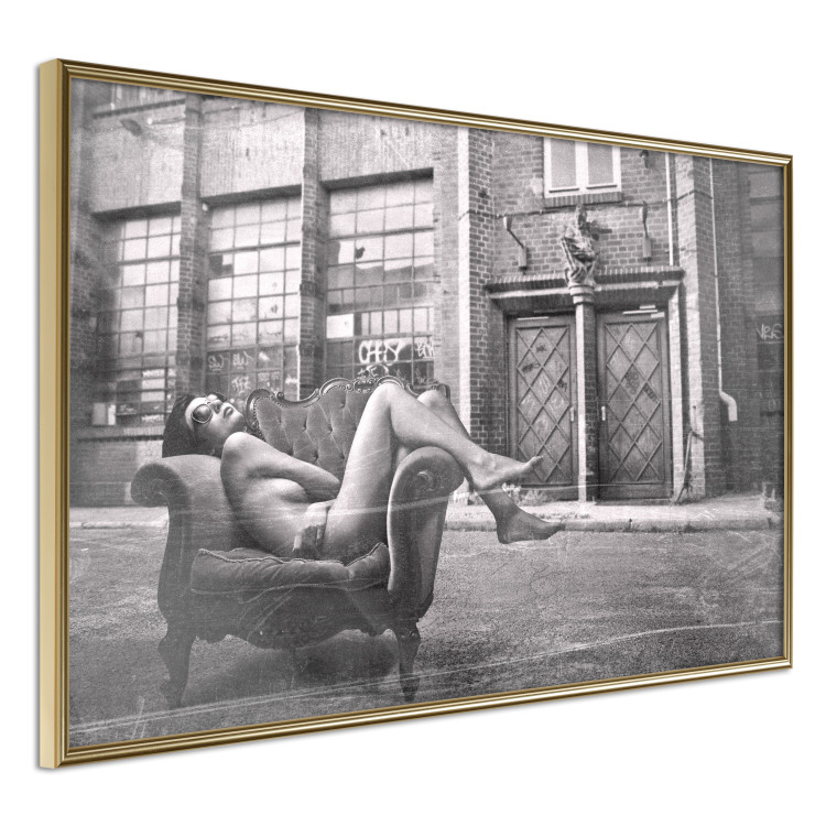Wall Poster Casual Pose - black and white landscape of a woman in a chair with a building in the background 134181 additionalImage 13