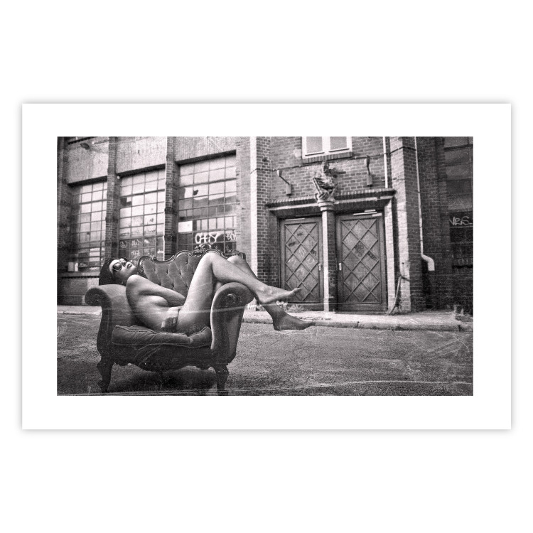 Wall Poster Casual Pose - black and white landscape of a woman in a chair with a building in the background 134181 additionalImage 25