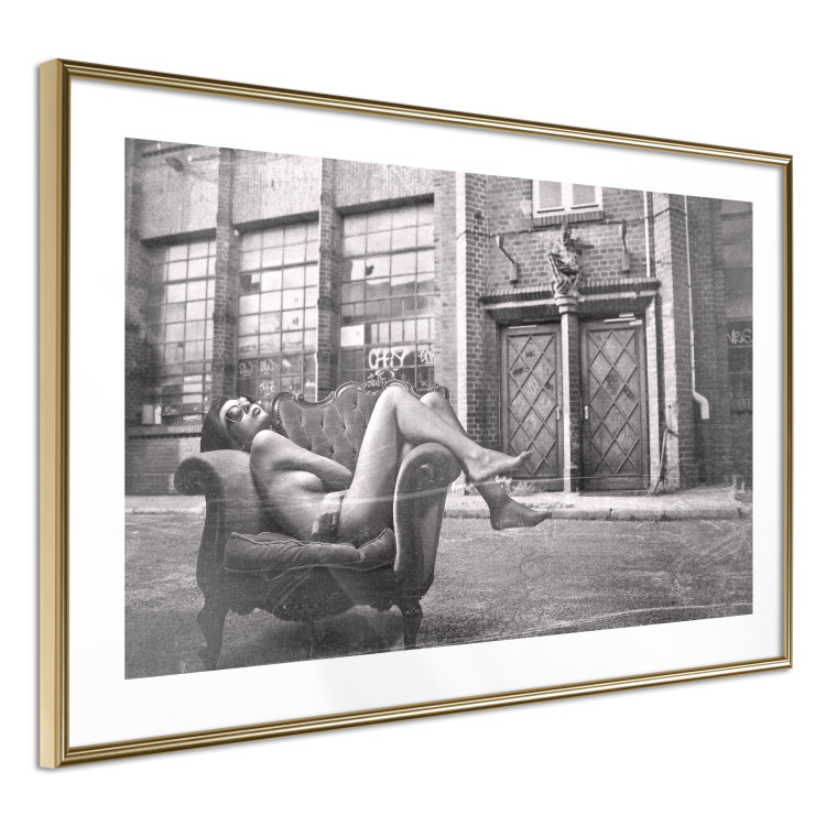 Wall Poster Casual Pose - black and white landscape of a woman in a chair with a building in the background 134181 additionalImage 11
