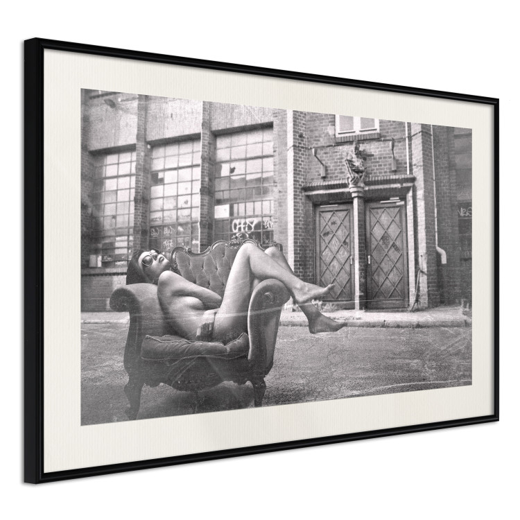 Wall Poster Casual Pose - black and white landscape of a woman in a chair with a building in the background 134181 additionalImage 6