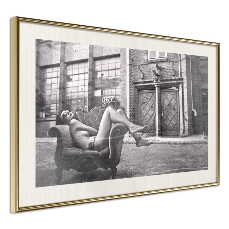 Wall Poster Casual Pose - black and white landscape of a woman in a chair with a building in the background 134181 additionalImage 8