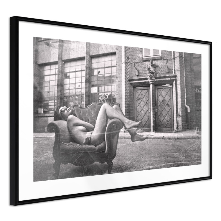 Wall Poster Casual Pose - black and white landscape of a woman in a chair with a building in the background 134181 additionalImage 14