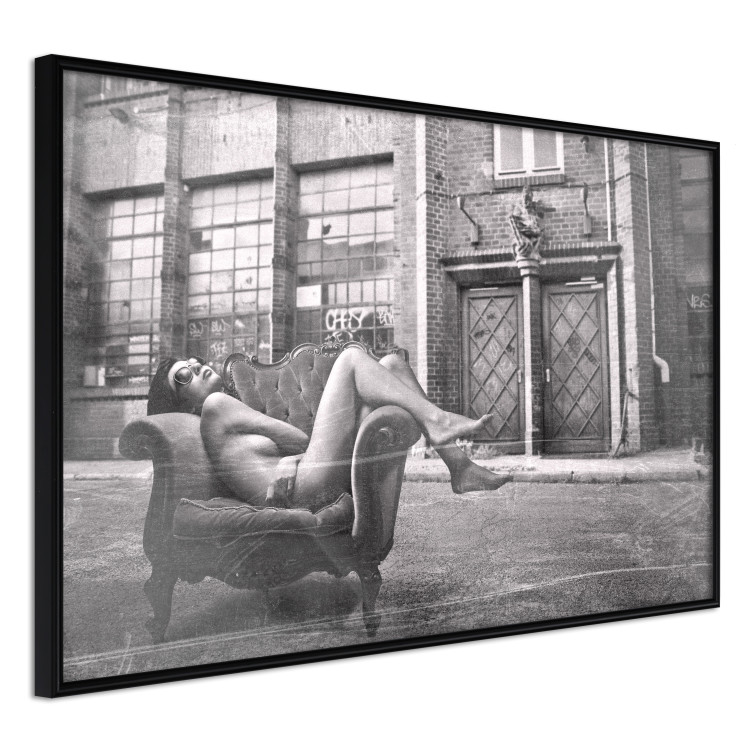 Wall Poster Casual Pose - black and white landscape of a woman in a chair with a building in the background 134181 additionalImage 10