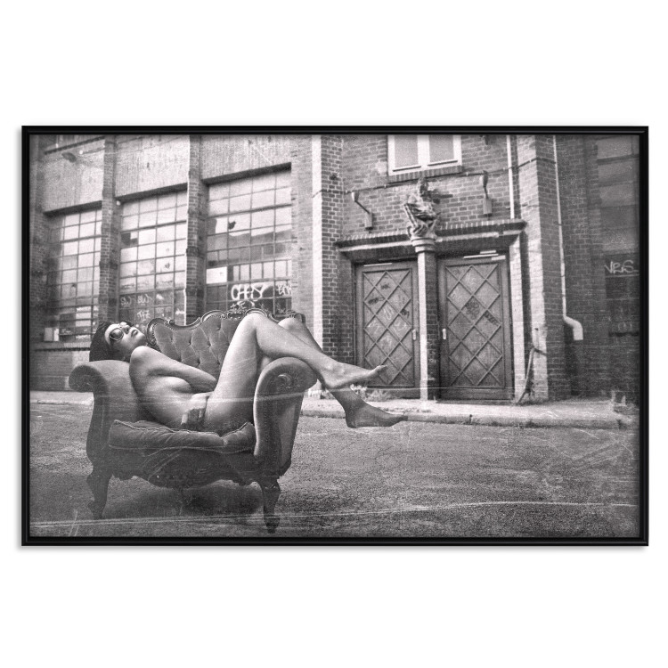 Wall Poster Casual Pose - black and white landscape of a woman in a chair with a building in the background 134181 additionalImage 18