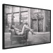 Wall Poster Casual Pose - black and white landscape of a woman in a chair with a building in the background 134181 additionalThumb 10
