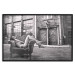 Wall Poster Casual Pose - black and white landscape of a woman in a chair with a building in the background 134181 additionalThumb 16