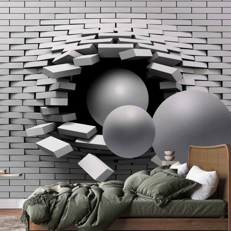 Photo Wallpaper Hole in the Wall - Broken white brick wall with a hole and gray spheres 61791 additionalImage 2