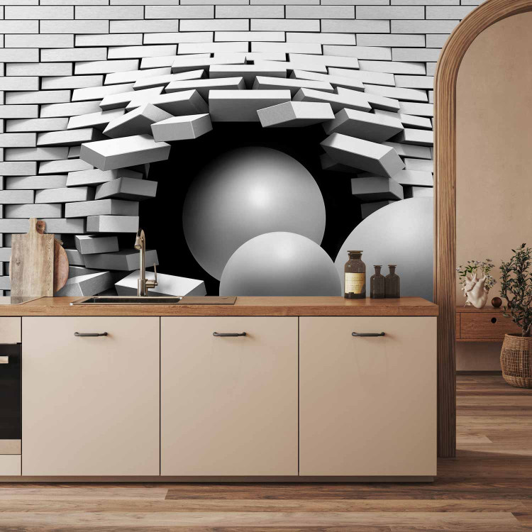 Photo Wallpaper Hole in the Wall - Broken white brick wall with a hole and gray spheres 61791 additionalImage 6