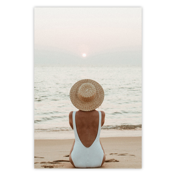 Wall Poster Beach Rest - woman sitting on the sand with sunset in the background 135902