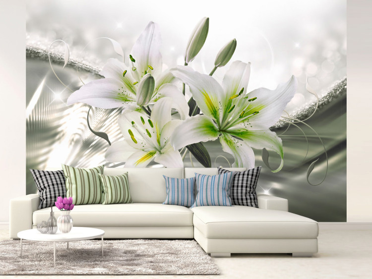 Wall Mural Beauty of the lily - white flowers on a background in green with light glow effect 93772