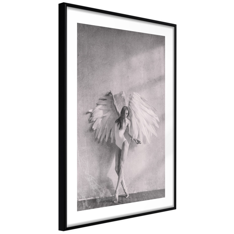 Wall Poster Winged - black and white woman with large wings against a concrete background 134182 additionalImage 4