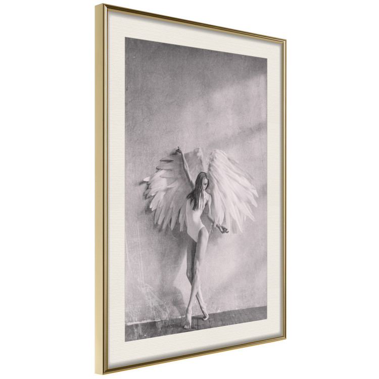 Wall Poster Winged - black and white woman with large wings against a concrete background 134182 additionalImage 2