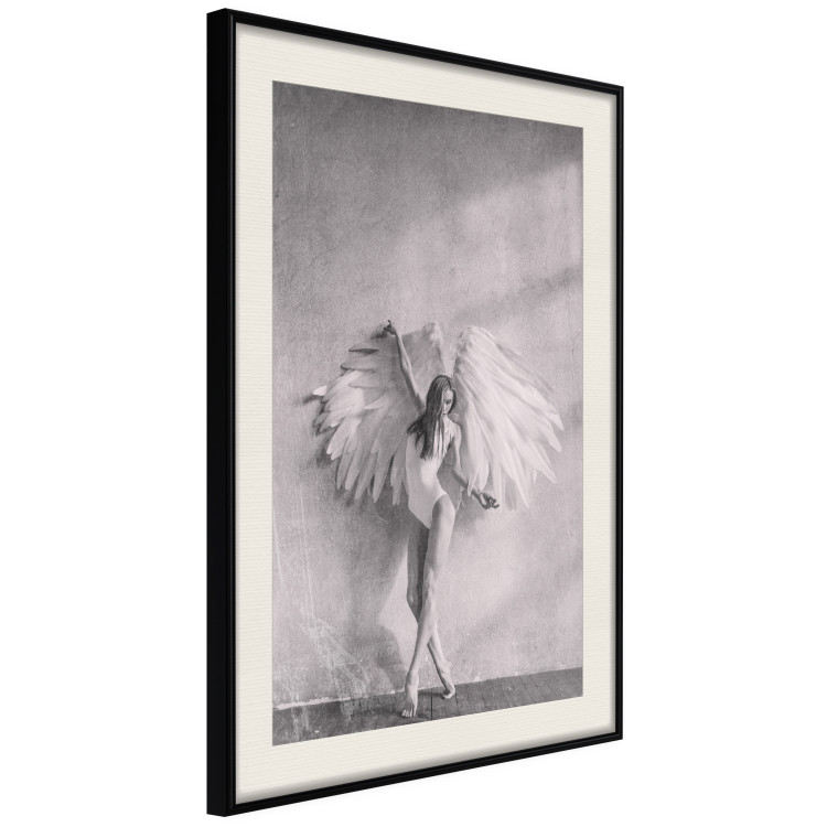 Wall Poster Winged - black and white woman with large wings against a concrete background 134182 additionalImage 3