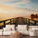Wall Mural Landscape - a bridge over a calm lake surrounded by birds and trees 91613