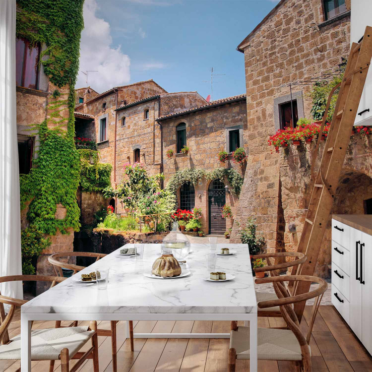 Wall Mural Street in Tuscany - Italian town with brick houses and flowers 97323 additionalImage 6