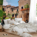 Wall Mural Street in Tuscany - Italian town with brick houses and flowers 97323 additionalThumb 2