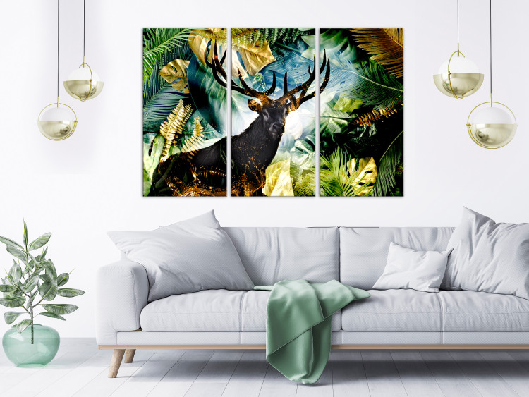 Canvas Print Surrounded by Forest (3-piece) - deer against a background of monstera and palm leaves 134573 additionalImage 3