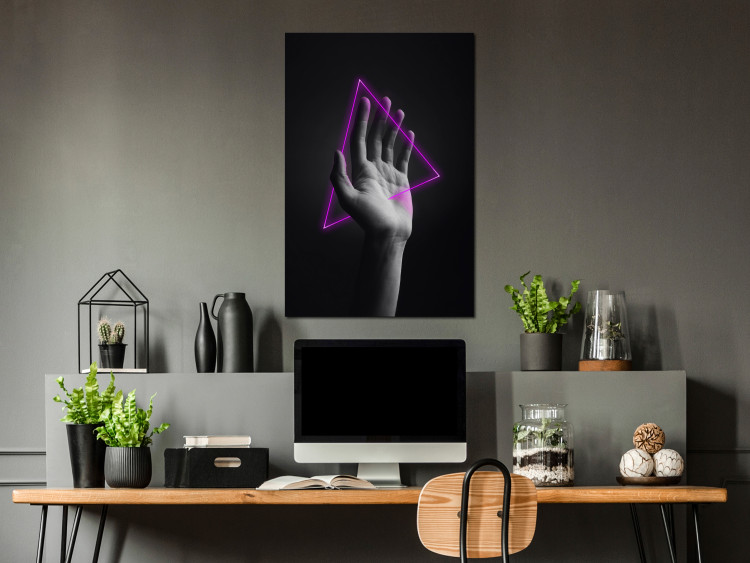Canvas Triangle in hand - neon figure in the hand on black background 125083 additionalImage 3