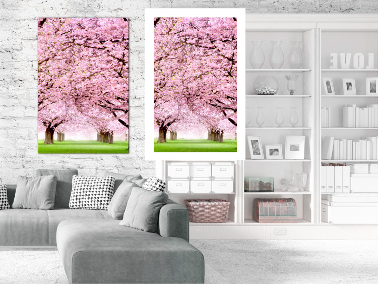 Poster Cherry Orchard - landscape of green grass and trees with pink leaves 126214 additionalImage 4