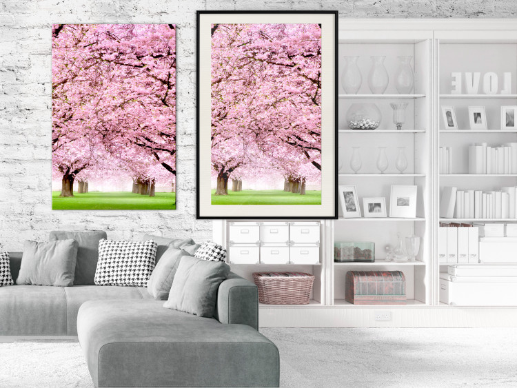 Poster Cherry Orchard - landscape of green grass and trees with pink leaves 126214 additionalImage 16