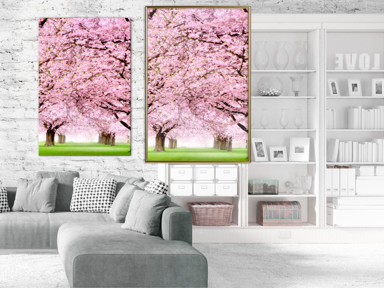 Poster Cherry Orchard - landscape of green grass and trees with pink leaves 126214 additionalImage 7